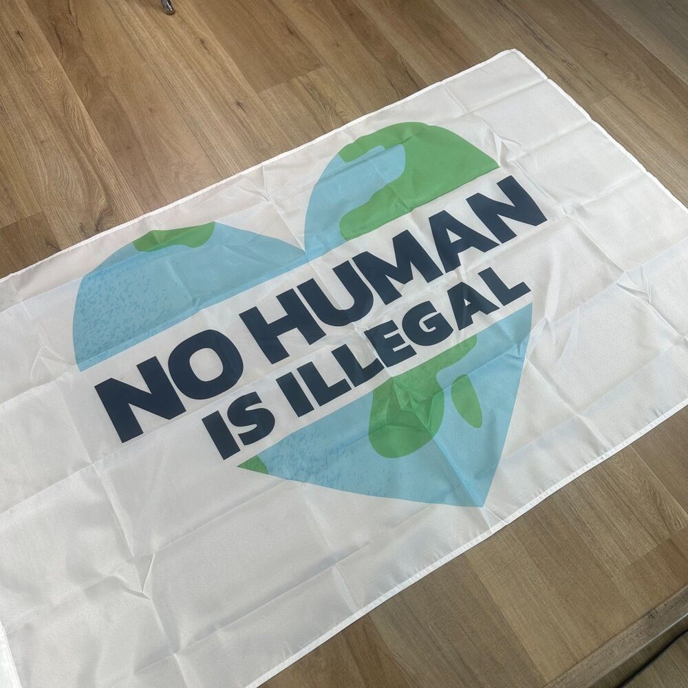 No Human Is Illegal Flag with Heart Shape Globe